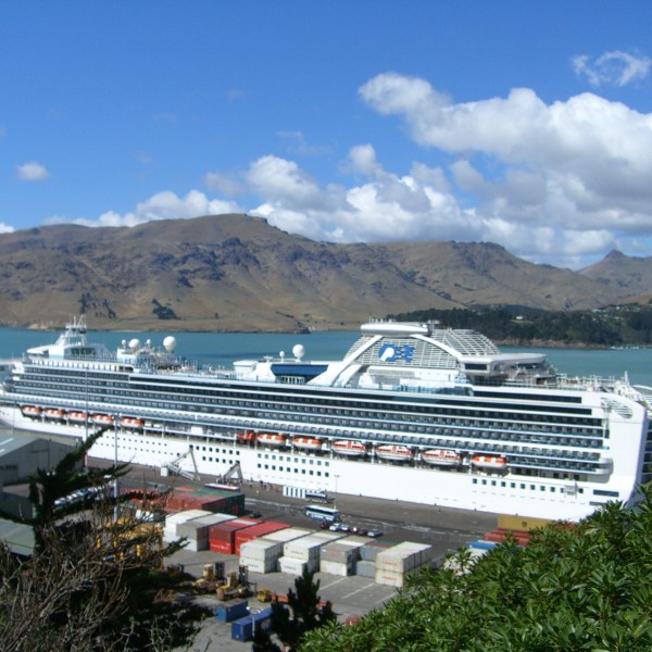 a boat is docked next to a body of water