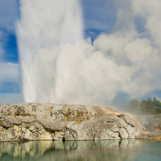 a body of water with a mountain in the background
