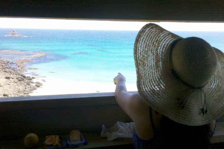 a person sitting at a beach